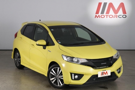 Image of a Yellow used Honda Fit Hybrid stock #32229 2014 stock number 32229