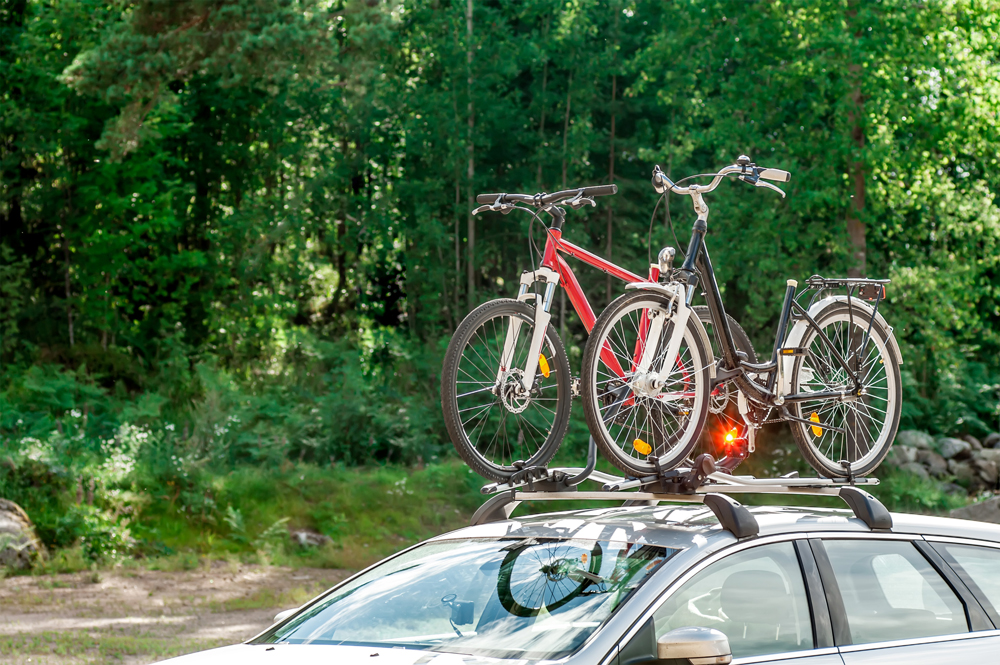 bicycle car accessories with two bikes on the roof of a vehicle