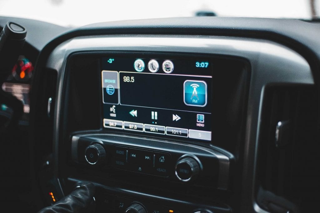 A close-up shot of a car’s stereo and navigation system.