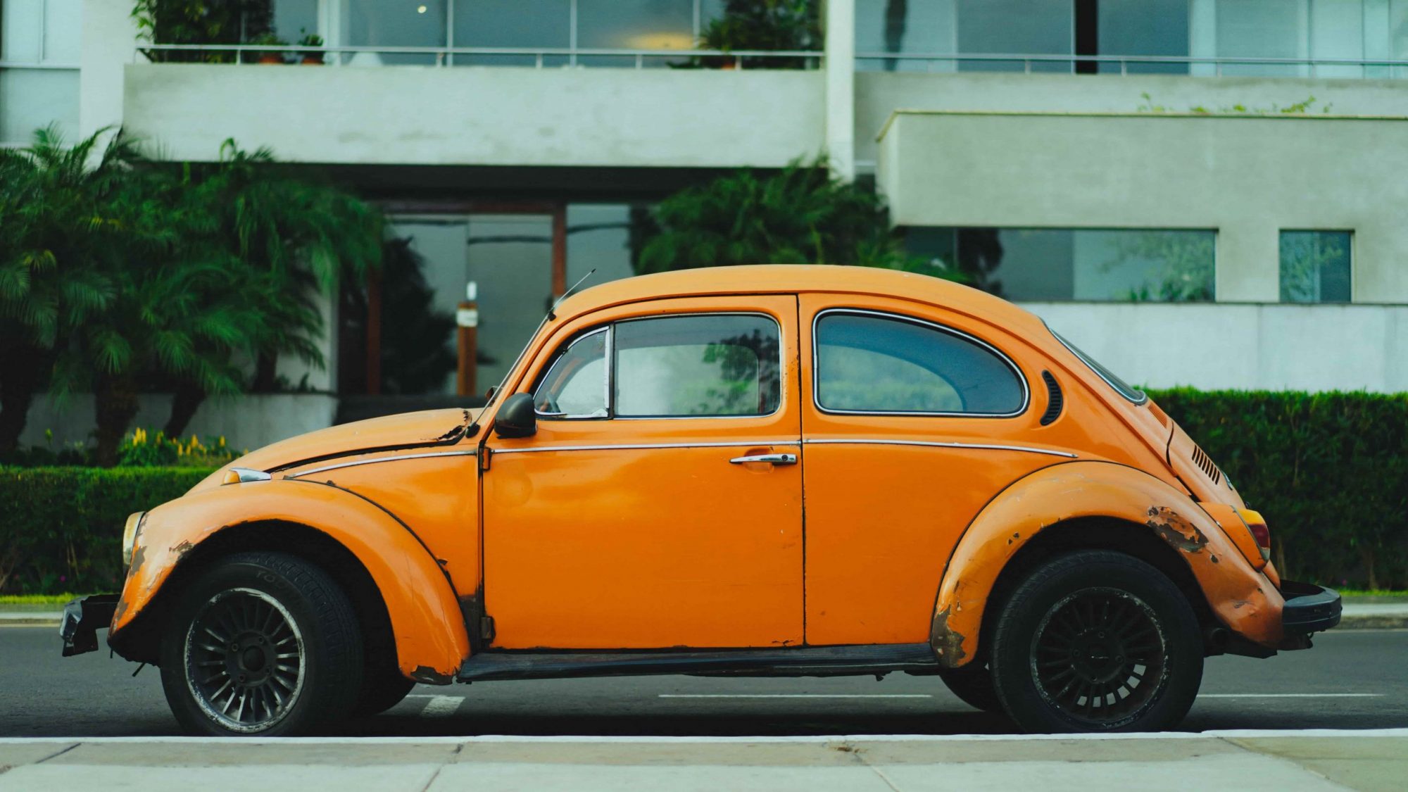 An old, orange Volkswagen Beetle; the type of second-hand vehicle most people don’t want.