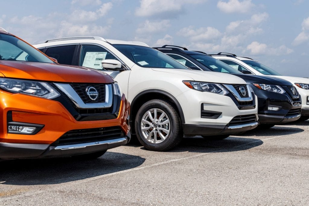 Line-up of Nissan used cars at a used car lot