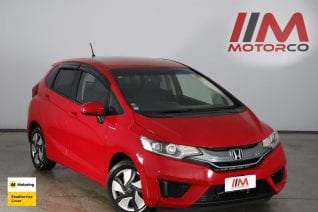 Image of a Red used Honda Fit Hybrid stock #32703 2014 stock number 32703