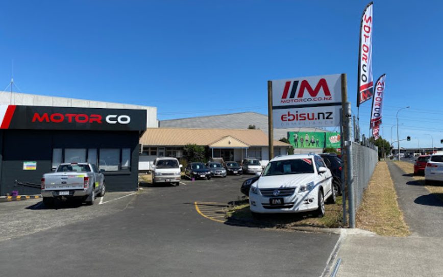 A wide shot of a MotorCo car yard where people can buy used cars in East Tamaki.