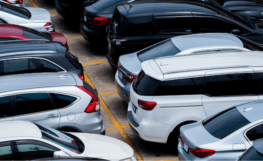Used cars parked in carpark at dealership